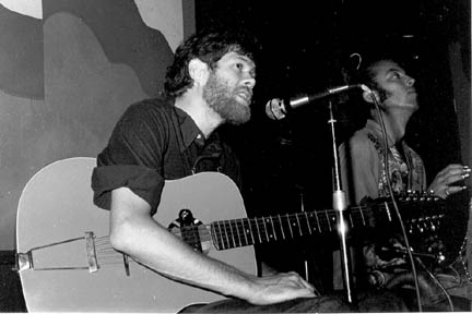 Spider John and Ol'Folkie Jim Higgins on washboard; August 6-7 1974, Jacks Bar, Cambridge, Massachusetts. Unknown person took the photograph.